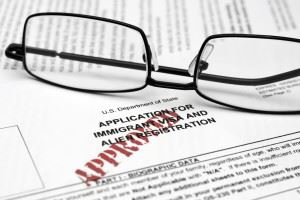 glasses laying on top of paperwork
