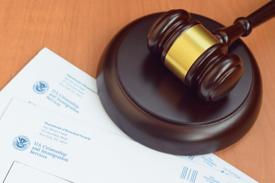 gavel and uscis paperwork